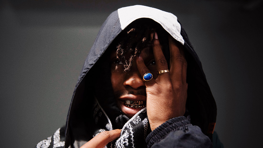 Image of rapper $not covering his left eye with his left hand. 